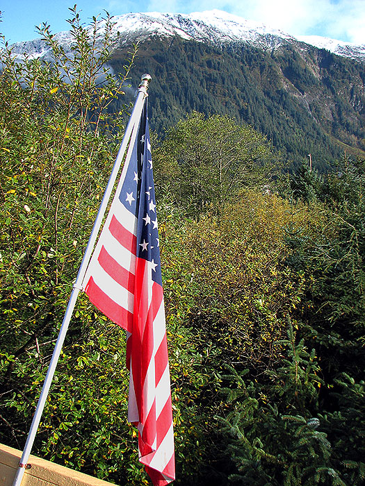 The United States Flag on Columbus Day, Mt. Juneau in the background.