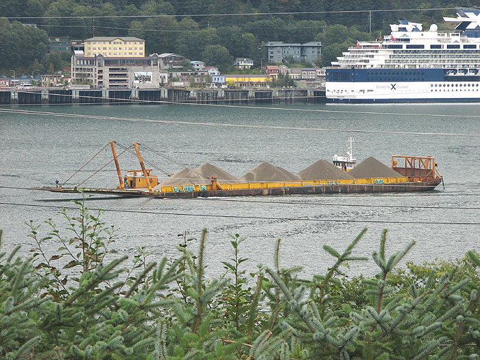Barge Loaded with Piles of Sand and Gravel.