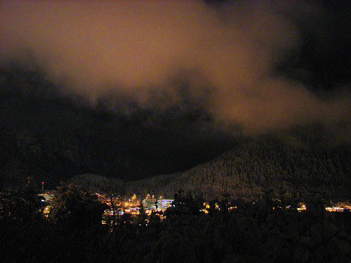 Lights of Juneau Lighting Snow on Mt. Roberts and Clouds.