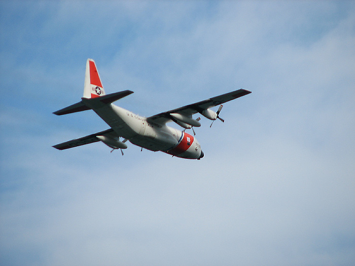 U.S. Coast Guard C-130 Aircraft flying SE (above Gastineau Channel).