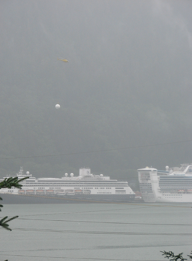 Coastal Helicopters flying a new Radome to Holland America Line's Statendam (not visible).